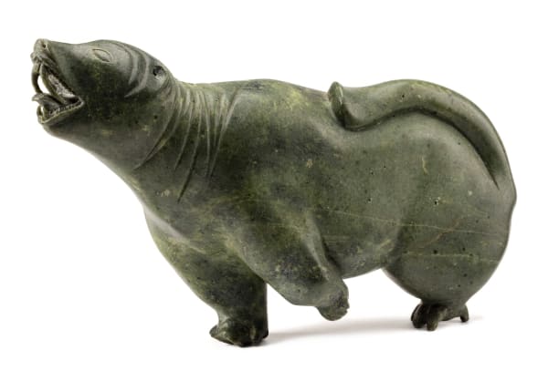 Lot 164 EEGYVUDLUK POOTOOGOOK (1931-1999) KINNGAIT (CAPE DORSET) Animal Spirit, c. 1964 stone, 9 x 14.5 x 4.25 in (22.9 x 36.8 x 10.8 cm) ESTIMATE: $6,000 — $9,000 PRICE REALIZED: $4,830.00