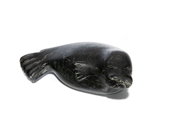 Lot 53 JAMASIE KASUDLUAK (1935-) INUKJUAK (PORT HARRISON) Resting Seal, c, 1960s stone, 3 x 7.5 x 4 in (7.6 x 19.1 x 10.2 cm) PRICE REALIZED: $123.00