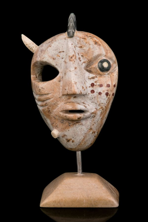 Lot 64 FLOYD KUPTANA (1964-2021) PAULATUK Maskette on Base, 1999 stone, antler, and red inlay, 9.25 x 5 x 3 in (23.5 x 12.7 x 7.6 cm) ESTIMATE: $1,000 — $1,500 PRICE REALIZED: $1,200.00