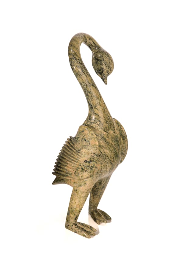 Lot 5 POOTOOGOOK QIATSUQ (1959-) KINNGAIT (CAPE DORSET) Preening Goose, 1990s stone, 17 x 5 x 7 in (43.2 x 12.7 x 17.8 cm) ESTIMATE: $1,000 — $1,500 PRICE REALIZED: $960.00
