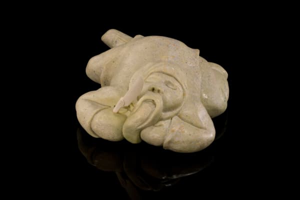 Lot 56 SILAS KAYAKJUAK (QAYAQJUAQ) (1956-) SANIRAJAK (HALL BEACH) / OTTAWA Resting Man, 2004 stone and antler, 3.5 x 7.25 x 8 in (8.9 x 18.4 x 20.3 cm) ESTIMATE: $600 — $900 PRICE REALIZED: $552.00