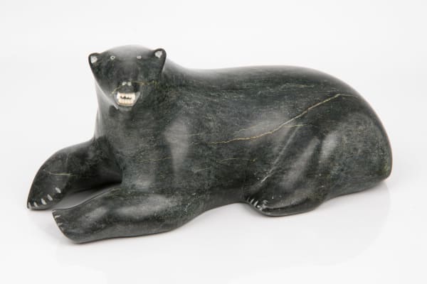 Lot 24 ANDY MAMGARK (1930-1997) ARVIAT (ESKIMO POINT) Bear, c. early 1990s stone and ivory, 3.75 x 7.5 x 4 in (9.5 x 19.1 x 10.2 cm) ESTIMATE: $800 — $1,200 PRICE REALIZED: $732.00