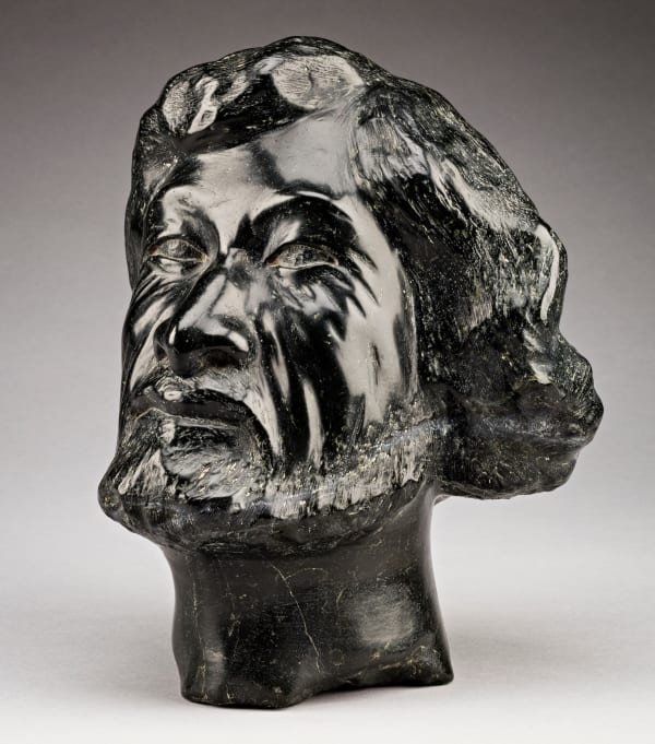 Lot 60 HENRY EVALUARDJUK (1923-2007) IQALUIT (FROBISHER BAY) Head of a Man (Self Portrait), probably early-mid 1980s stone, 9.25 x 7 x 7.5 in (23.5 x 17.8 x 19.1 cm) ESTIMATE: $4,000 — $6,000 PRICE REALIZED: $16,800.00