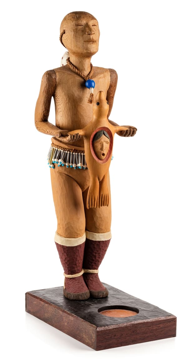 Lot 76 LAWRENCE (LARRY ULAAQ) AHVAKANA (1946-) INUPIAQ Anatkut At Winter Ceremonial Calling Seal Helping Spirit, December 2010 red and yellow cedar, wood, ivory, glass and resin beads, metal and plastic conical beads, cedar bark, catlinite, cotton string, and pigment, 25 x 11.75 x 7.25 in (63.5 x 29.8 x 18.4 cm) ESTIMATE: $8,000 — $12,000 price realized: $5,550.00