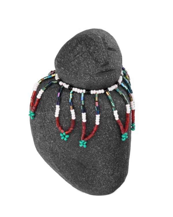 Lot 37 MARY TUTSWEETOK (1927-1995) ARVIAT (ESKIMO POINT) Woman in a Beaded Amautiq, 2000s stone, beads, and thread, 4 x 3 x 3.25 in (10.2 x 7.6 x 8.3 cm) ESTIMATE: $400 — $600 PRICE REALIZED: $366.00