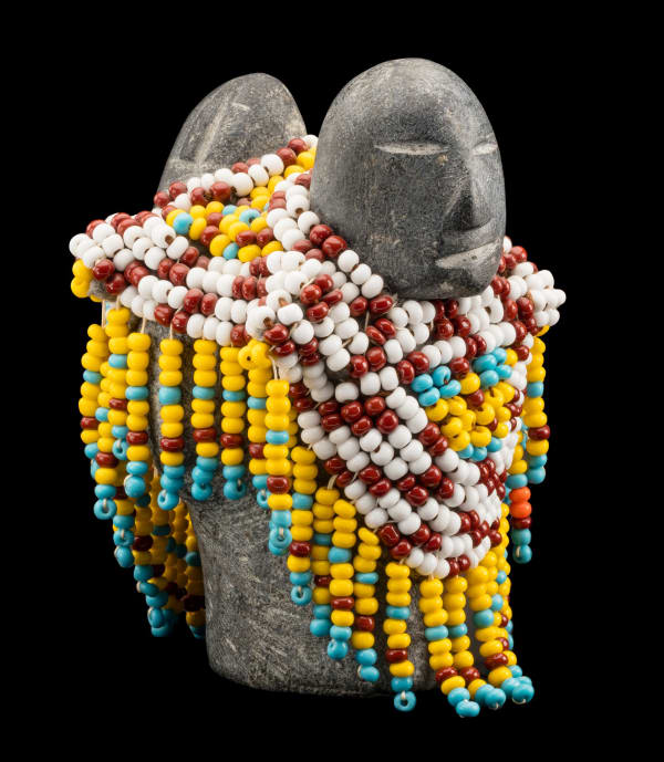Lot 129 EVA TALOOKI ALIKTILUK (1927-1994) ARVIAT (ESKIMO POINT) Mother and Child in a Beaded Amautiq, c. 1990-91 stone, glass beads, felt, and thread, 4.5 x 3 x 3 in (11.4 x 7.6 x 7.6 cm) ESTIMATE: $1,200 — $1,800 PRICE REALIZED: $1,020.00