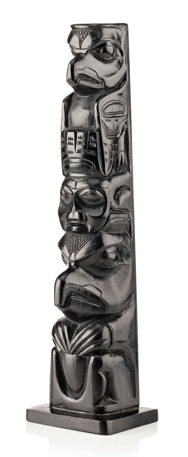 Lot 125 ATTRIBUTED TO PAUL JONES (c. 1847-1927), SKIDEGATE, HAIDA GWAII Model Totem Pole, c. 1900-1910 argillite, 10 x 2.5 x 2.25 in (25.4 x 6.3 x 5.7 cm) ESTIMATE: $2,500 — $3,500 PRICE REALIZED: $2,160.00