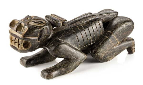 Lot 77 UNIDENTIFIED GREENLANDIC ARTIST Tupilak, possibly 1940s or 1950s stone, 3.5 x 9 x 3.25 (8.9 x 22.9 x 8.3 cm) ESTIMATE: $3,500 — $5,000 price realized: $3,660.00