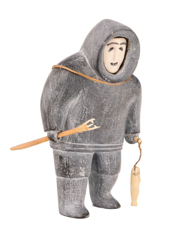 Lot 38 UNIDENTIFIED INUIT ARTIST, NUNAVIK (ARCTIC QUEBEC) Fisherman Setting Out with a Heavy Pack, mid-late 1950s stone, leather, wood, ivory, and string, 5.5 x 3.25 x 2.5 in (14 x 8.3 x 6.3 cm) ESTIMATE: $600 — $900 PRICE REALIZED: $561.20