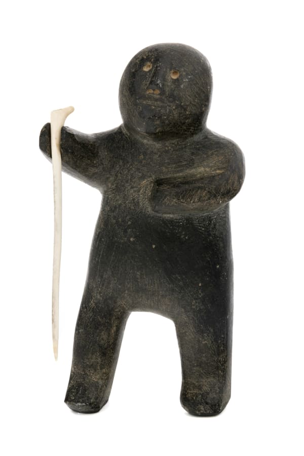 Lot 9 MARC ALIKASWA (1928-2008) ARVIAT (ESKIMO POINT) Man with Snow Probe, mid-late 1970s stone and antler, 7.5 x 4 x 2 in (19.1 x 10.2 x 5.1 cm) ESTIMATE: $800 — $1,200 PRICE REALIZED: $780.00