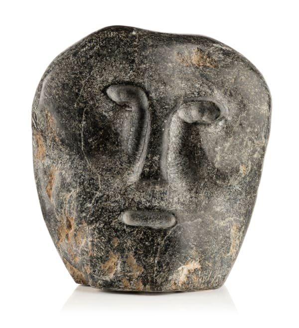 Lot 119 JOHN TIKTAK, R.C.A. (1916-1981) KANGIQLINIQ (RANKIN INLET) Janus Head, c. 1975-76 stone, 6 x 5.5 x 2.75 in (15.2 x 14 x 7 cm) ESTIMATE: $5,000 — $8,000 PRICE REALIZED: $7,200.00