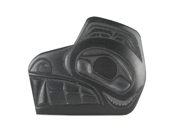 Lot 25 PAT DIXON (1938-2015) HAIDA Wolf Head Brooch, late 1980s argillite, 1.5 x 2 x 0.125 in (3.8 x 5.1 x 0.3 cm) ESTIMATE: $80 — $120 PRICE REALIZED: $36.60