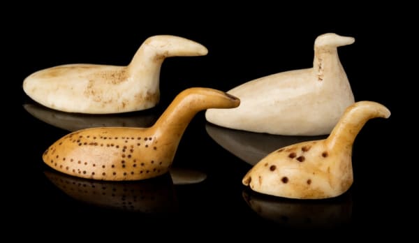 Lot 105 INUIT AND POSSIBLY THULE CULTURE MAKERS, EASTERN CANADIAN ARCTIC Four Bird Game Pieces, before 1935 mediums variable, ivory / ivory and black pigment, the largest: 0.75 x 1.75 x 0.75 in (1.9 x 4.4 x 1.9 cm) ESTIMATE: $500 — $800 PRICE REALIZED: $414.80