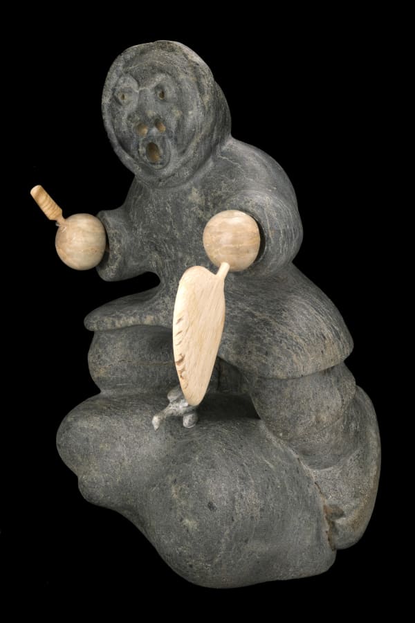 Lot 54 SAI QITAITU, UQSUQTUUQ (GJOA HAVEN) Drum Dancer, c. 1980s stone and musk ox horn, 15.25 x 9 x 9.75 in (38.7 x 22.9 x 24.8 cm) ESTIMATE: $700 — $1,000