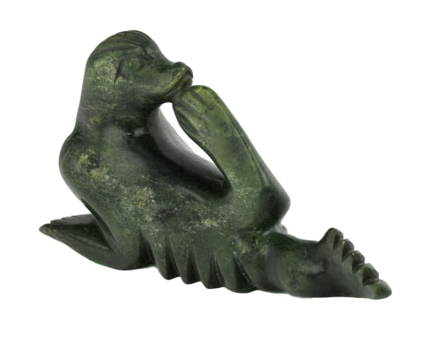 Lot 45 KOOMWARTOK ASHOONA (1930-1984) KINNGAIT (CAPE DORSET) Spirit Figure, mid-late 1970s stone, 5.75 x 10.5 x 5.25 in (14.6 x 26.7 x 13.3 cm) ESTIMATE: $1,200 — $1,800