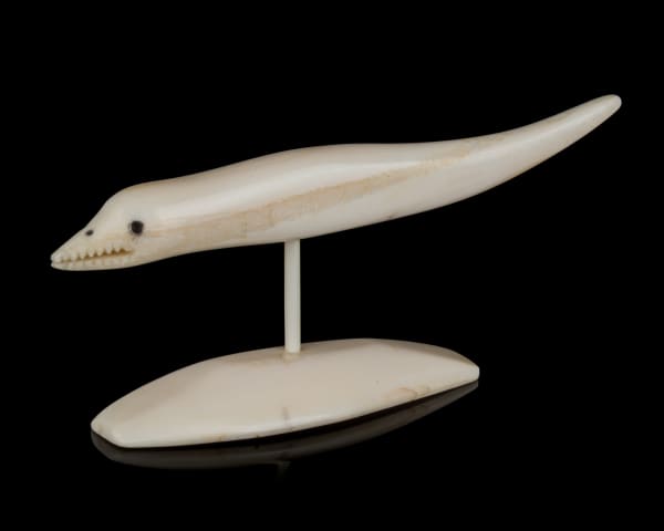 Lot 21 UNIDENTIFIED INUIT ARTIST Fish Spirit, 1980s ivory and black inlay, 1.75 x 4 x 1 in (4.4 x 10.2 x 2.5 cm) ESTIMATE: $80 — $120