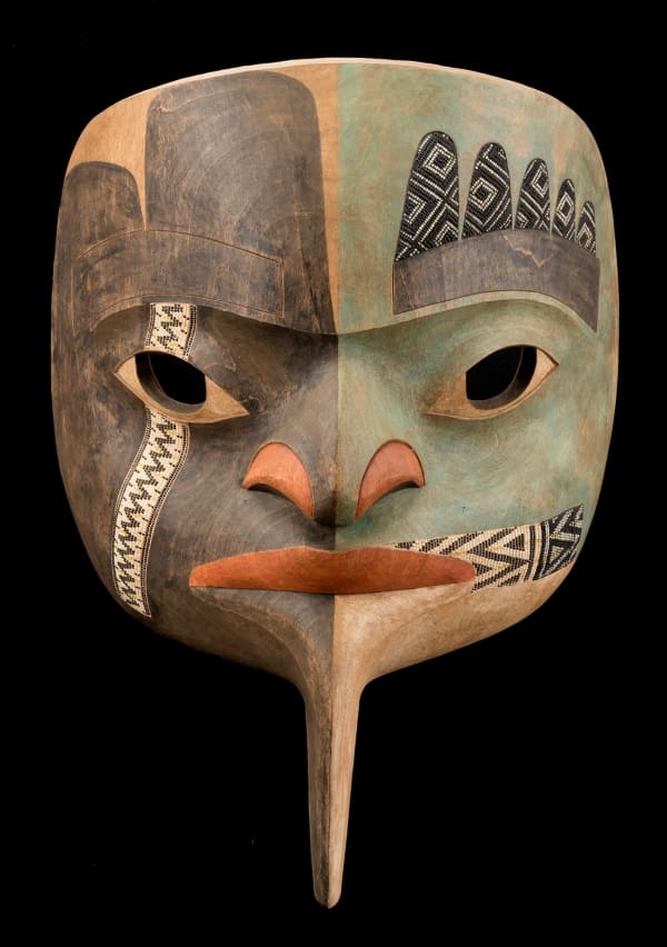 Lot 64 SCOTT JENSEN and COURTNEY LIPSON, NON-INDIGENOUS, EACH ADOPTED TLINGIT "Raven Paints His Face" Mask, 2013 wood, pigment, and inlaid glass beads, 13.5 x 9.5 x 6 in (34.3 x 24.1 x 15.2 cm) ESTIMATE: $1,800 — $2,800 price realized: $1,708.00