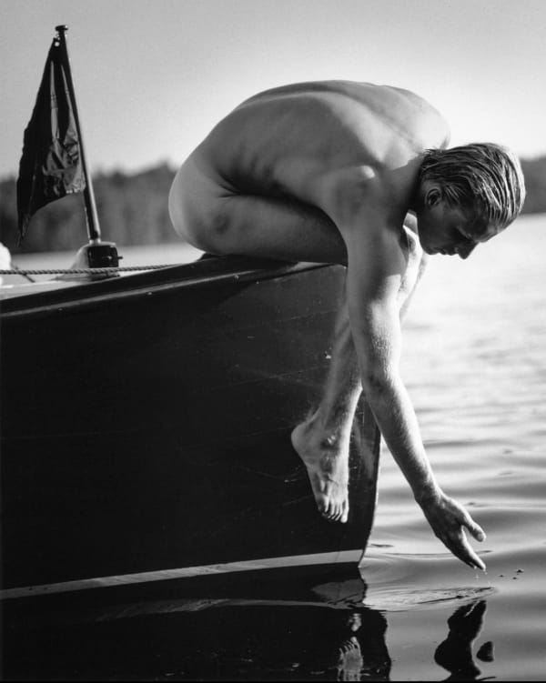 Bruce Weber, Tyke on the Work Boat, Lower St. Regis Lake, Adirondacks, NY, 1988.