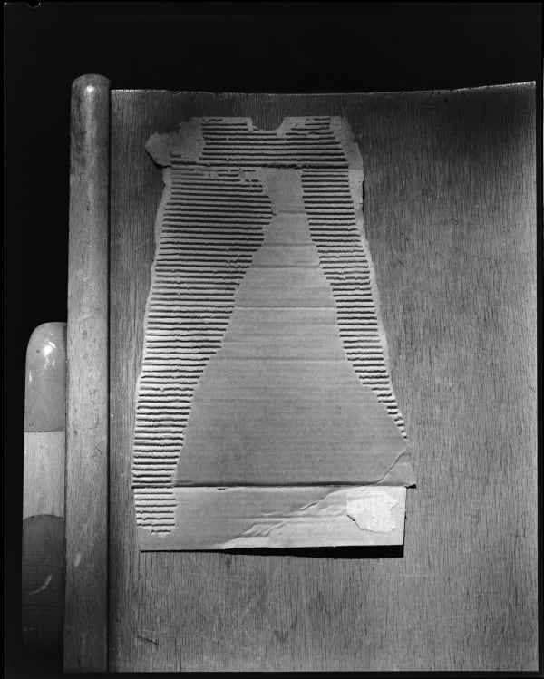 Thomas Manneke, cardboard on chair