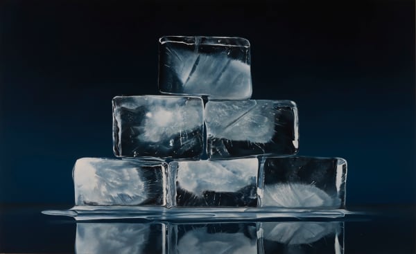 large ice cubes stacked in a pyramid with blue background