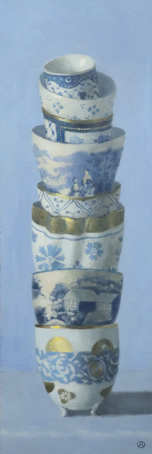 Stack of white and gold cups with ornate designs