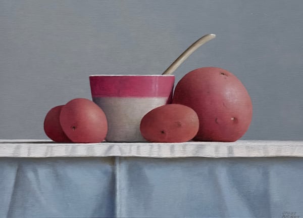 Still life painting of a cup with potatoes