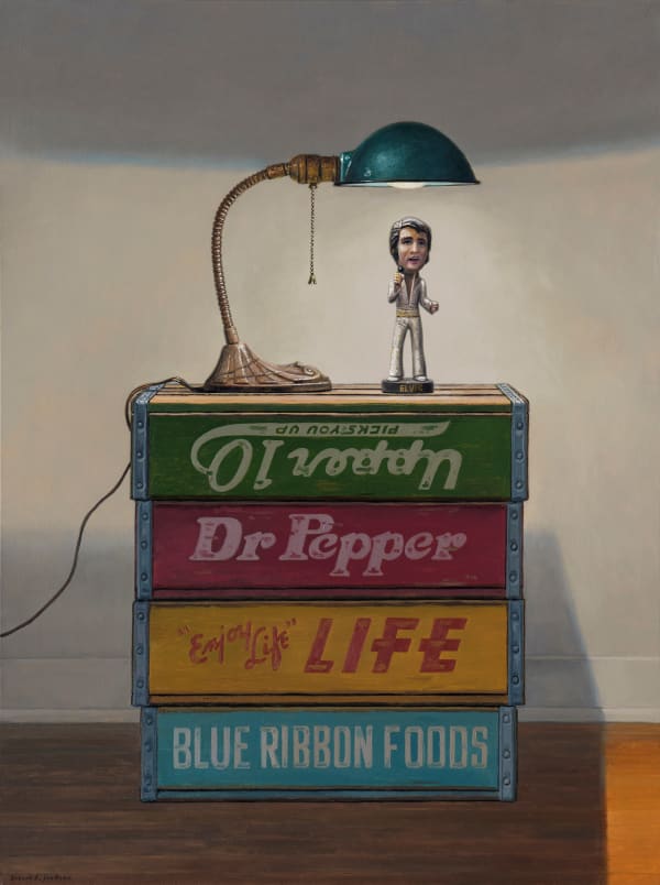Painting of an Elvis figurine on top of a box with a desk lamp