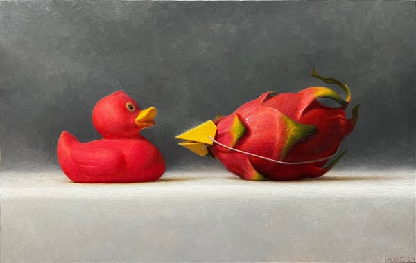 Painting of a rubber duck and a dragon fruit with a paper beak