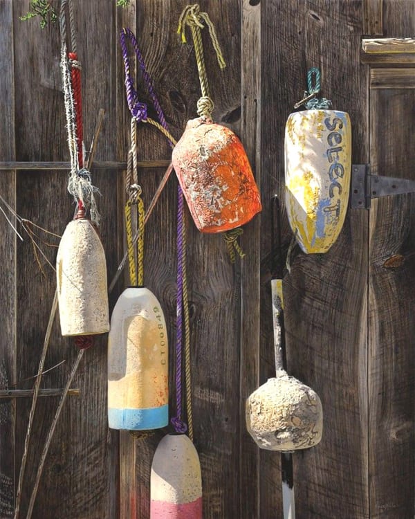 Painting of buoys hanging on a wood fence