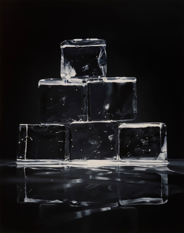 Dark background with very transparent ice cubes stacked in a pyramid