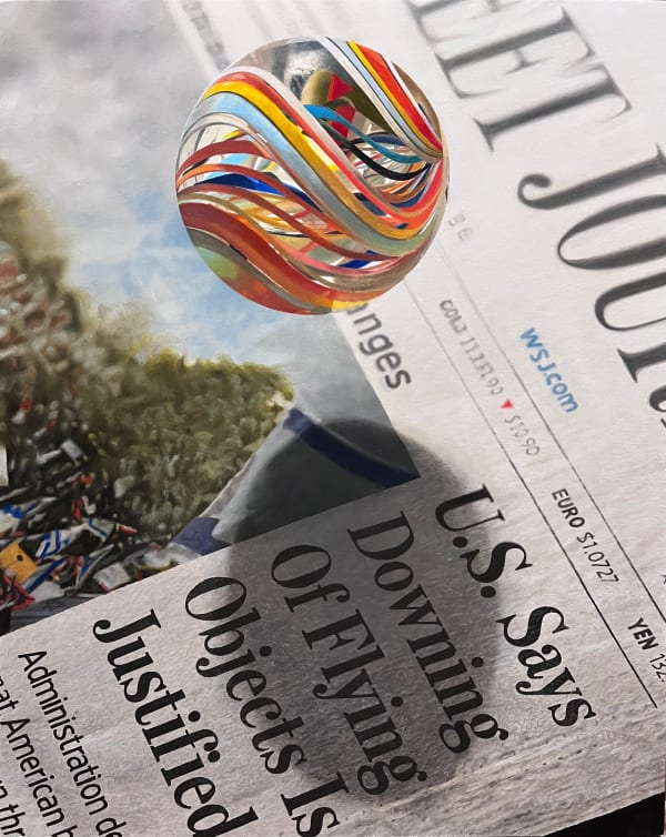 Marble Floating over a Wall Street Journal News Paper with a head line that says U.S> Says Downing of Flying Objects Is Justified.