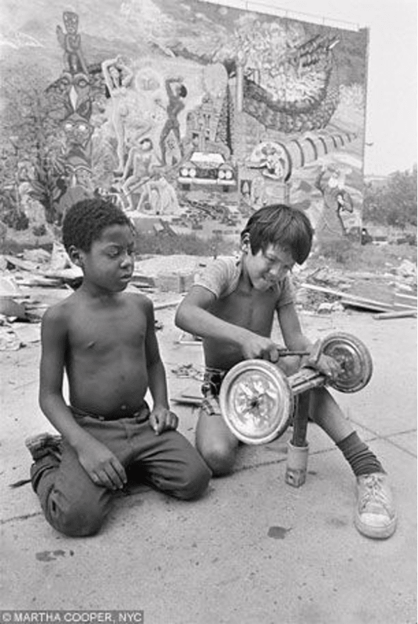 Martha Cooper, Boys making a go-cart from found materials, Lower Eastside, NYC, 1978