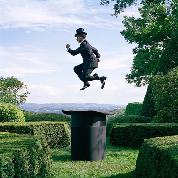 buy Rodney Sith photography man jumping over top hat color photo