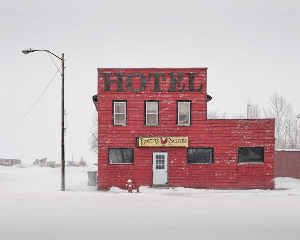 Red hotel in snow photograph