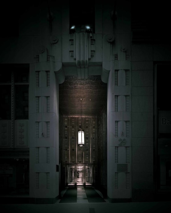 Dark, moody door arch on Wall Street in NYC