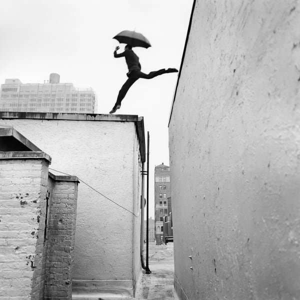 rodney smith Getty image photograph on man in suit leaping between rooftops