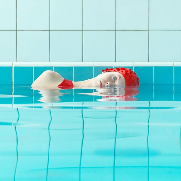 Swimming pool series Slovakian Photographer Maria Svarbova buy original prints here Gilman Contemporary Sun Valley art gallery red bathingsuit