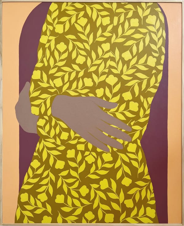 Woman in bright yellow dress with floral pattern