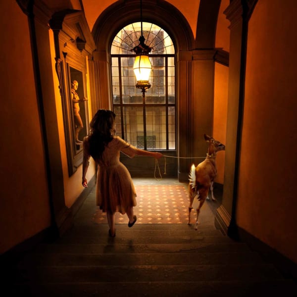 Tom Chambers photograph woman in hallway with deer buy original here Sun Valley contemporary art Gilman gallery Idaho