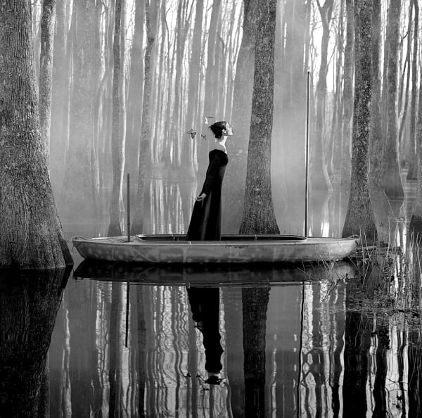 Rodney Smith photograph woman floating through water in boat buy here Gilman Contemporary Sun Valley art gallery