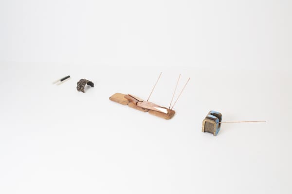 Lucy Skaer In the Yew Woods, Arrows Rain Down, The Day is Bright and Open, Hare Darts for Cover and the Chord of C Minor Sounds, 2018 Bronze, yew, copper, oil paint, stone Approx: 70 x 120 x 280 cm | 27 1/2 x 47 1/4 x 110 1/4 in