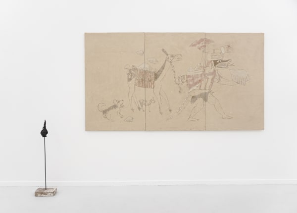 A mixed media clay and ceramic painting hanging on a white wall