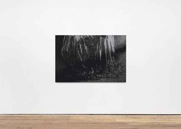 An inkjet print depicting a dark unidentifiable object.