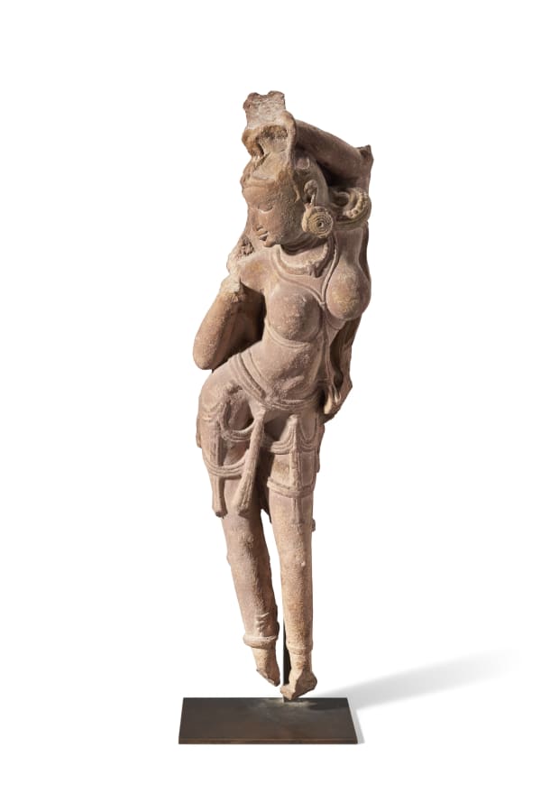 A red sandstone figure of a celestial woman India, Rajasthan or Madhya Pradesh, 10th-11th century Height: 63.5 cm (25 in)