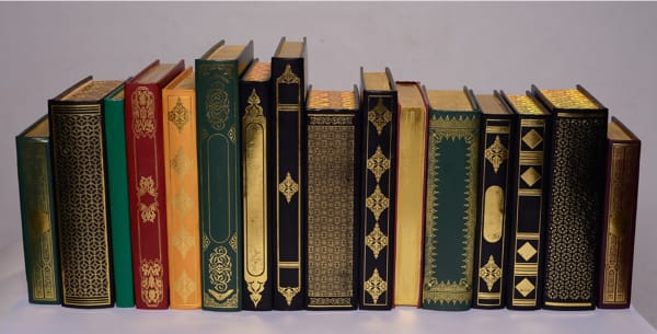 Imran Muddassar b. 1982The Holy Invitation 1 (set of 16 books), 2017 Leather, paper and Goldleaf Impression on Book Cover 29.2 x 68.6 cm 11 1/2 x 27 in