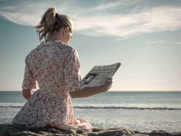 Girl Reads about the Death of James Dean