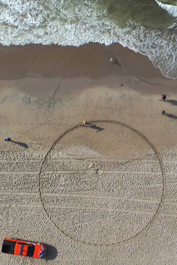 Running a Circle on a Crowded Beach