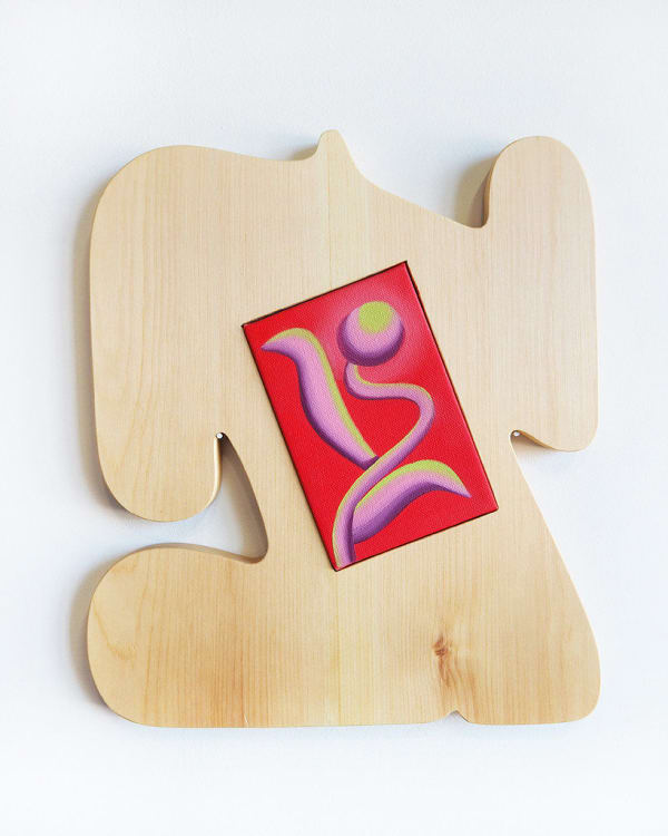 organically-shaped light colored wood sculpture with an inlaid small, vibrant red canvas in the center by Jocelyn Tsaih
