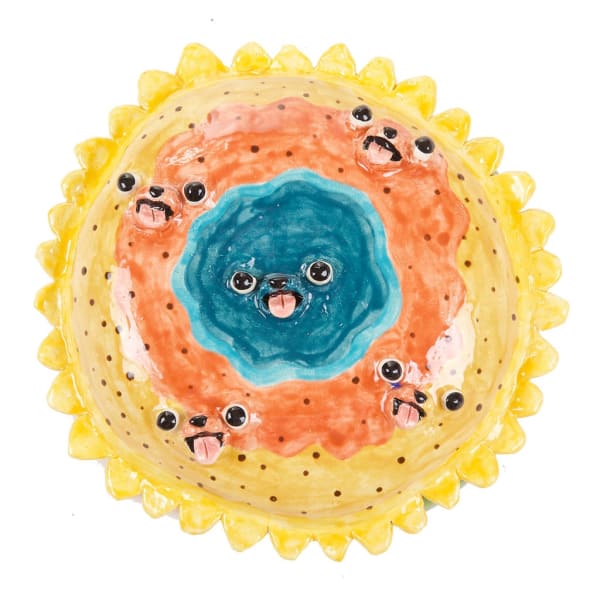 Katie Kimmel's ceramic sculpture of a sunflower with a face