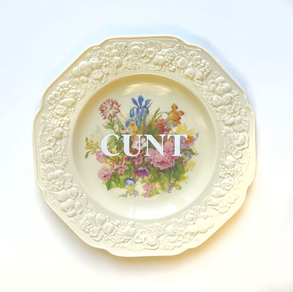Plate reading "Cunt"